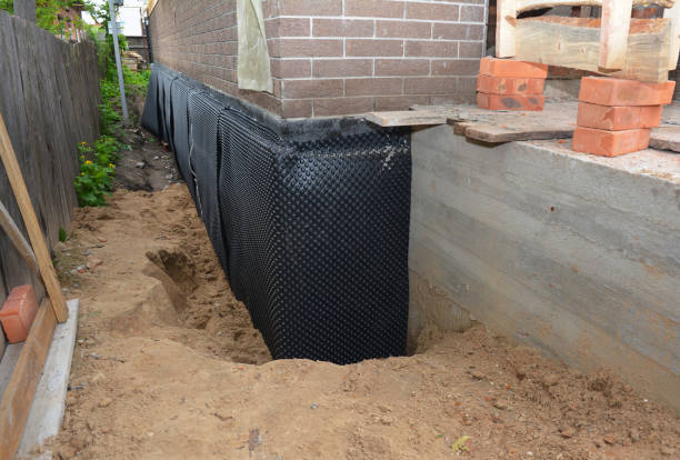 Happy homeowners after waterproofing job in Ottsville